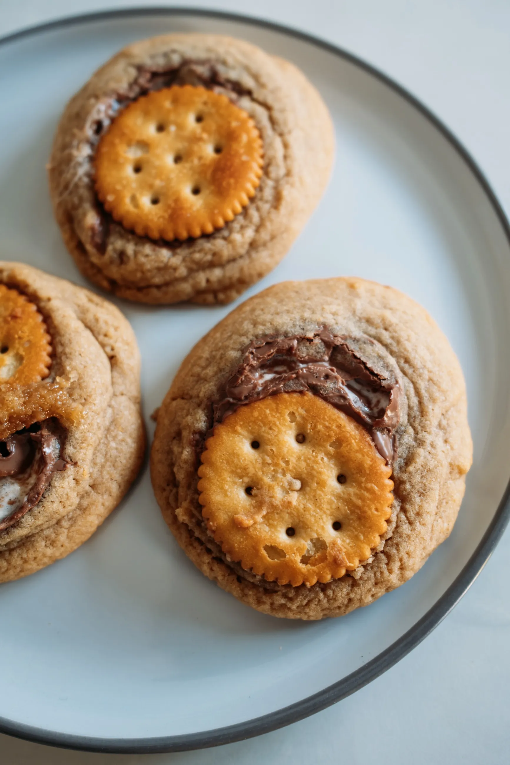 Chocolate-filled cookies topped with biscuits